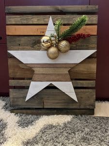 The Pallet Star Star mounted to pallet frame for rustic decor look.