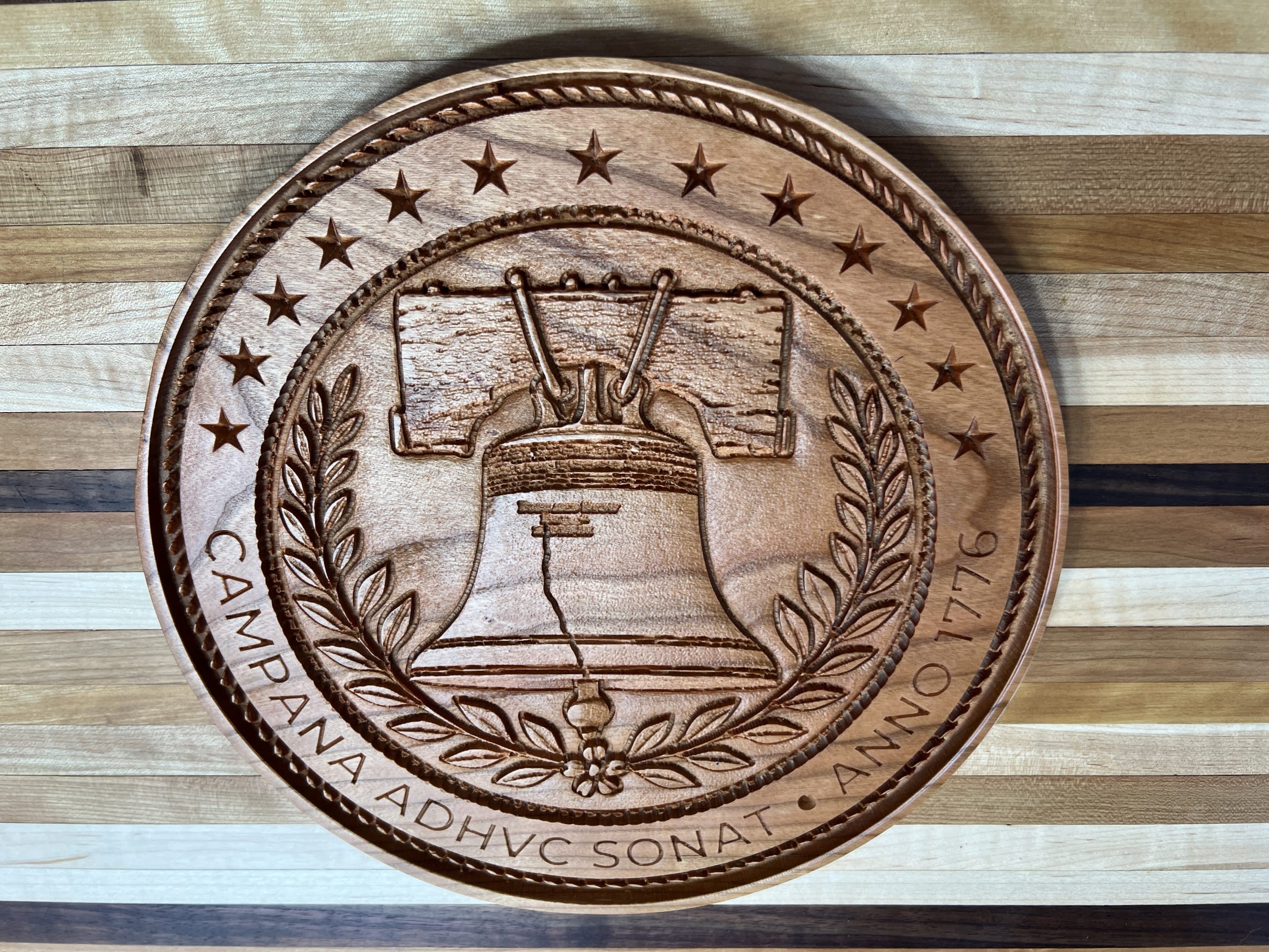 Wood Shoppe 2.0 -- CHERRY 10 Campana Angled Top View Image of the 10" cherry Campana Adhuv Sonat | Anno 1776 emblem made by Wood Shoppe 2.0.